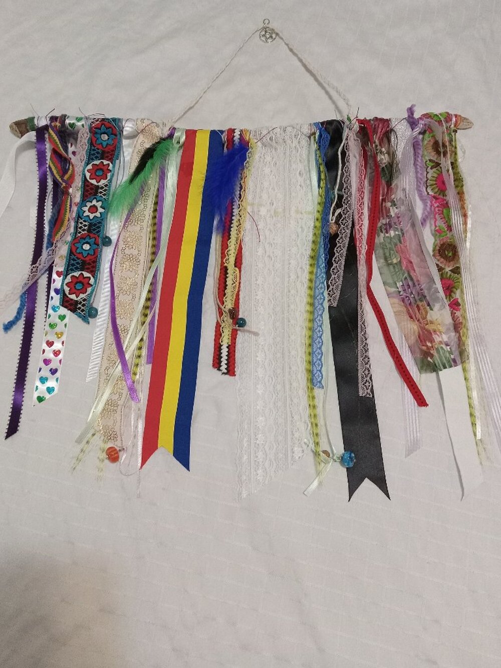 Handcrafted artistic banner made from treated driftwood, ribbons & decorations